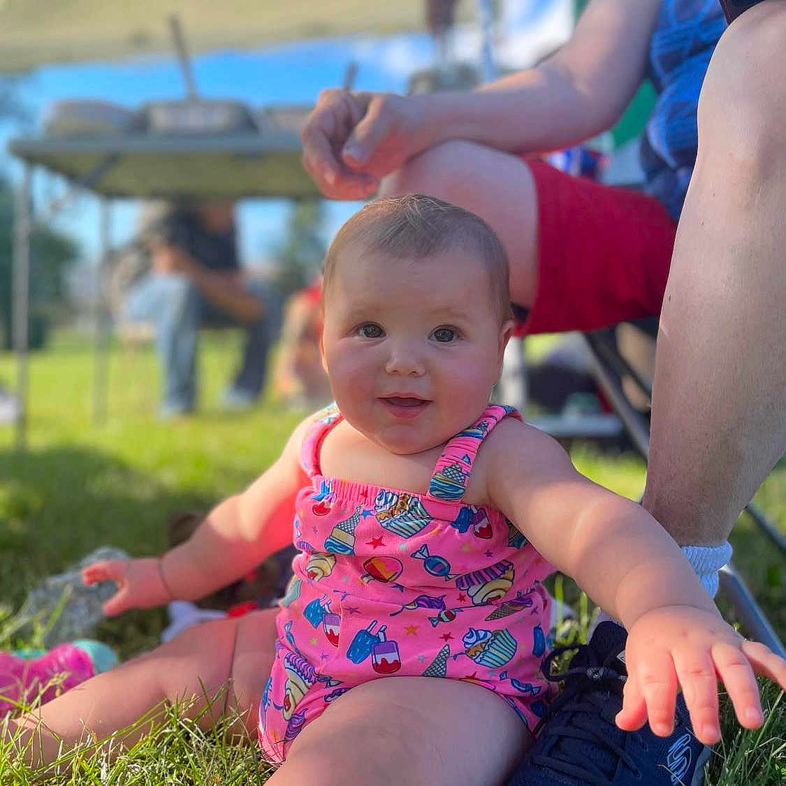 Debra is registered to the contest to win money with this photo: architecture, baby, backyard, building, clothing, face, grass, head, nature, outdoors, park, person, photography, plant, portrait, shelter, shorts, sitting, summer, yard