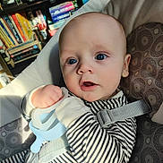 Carlin joined the competition — help win amazing prizes! baby, bed, bodypart, bookcase, clothing, couch, cushion, face, finger, furniture, hand, head, homedecor, indoors, newborn, pants, person, photography, portrait, shelf