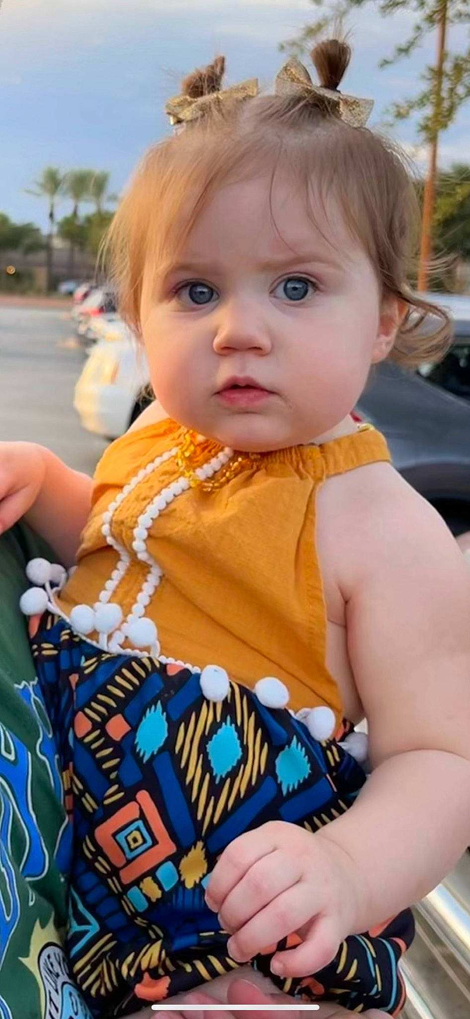 Payten is registered to the contest to win money with this photo: baby, baby_toddler_clothing, blue, child, dress, face, hairstyle, happy, head, leisure, nose, orange, organ, person, photograph, recreation, skin, sky, summer, toddler