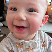 Callaway joined the competition — help win amazing prizes! baby, child, face, smile, happy, onesie, clothing, indoor, cute, closeup, infant, person, portrait, skin, expression, cheerful, eyes, head, young, babywear