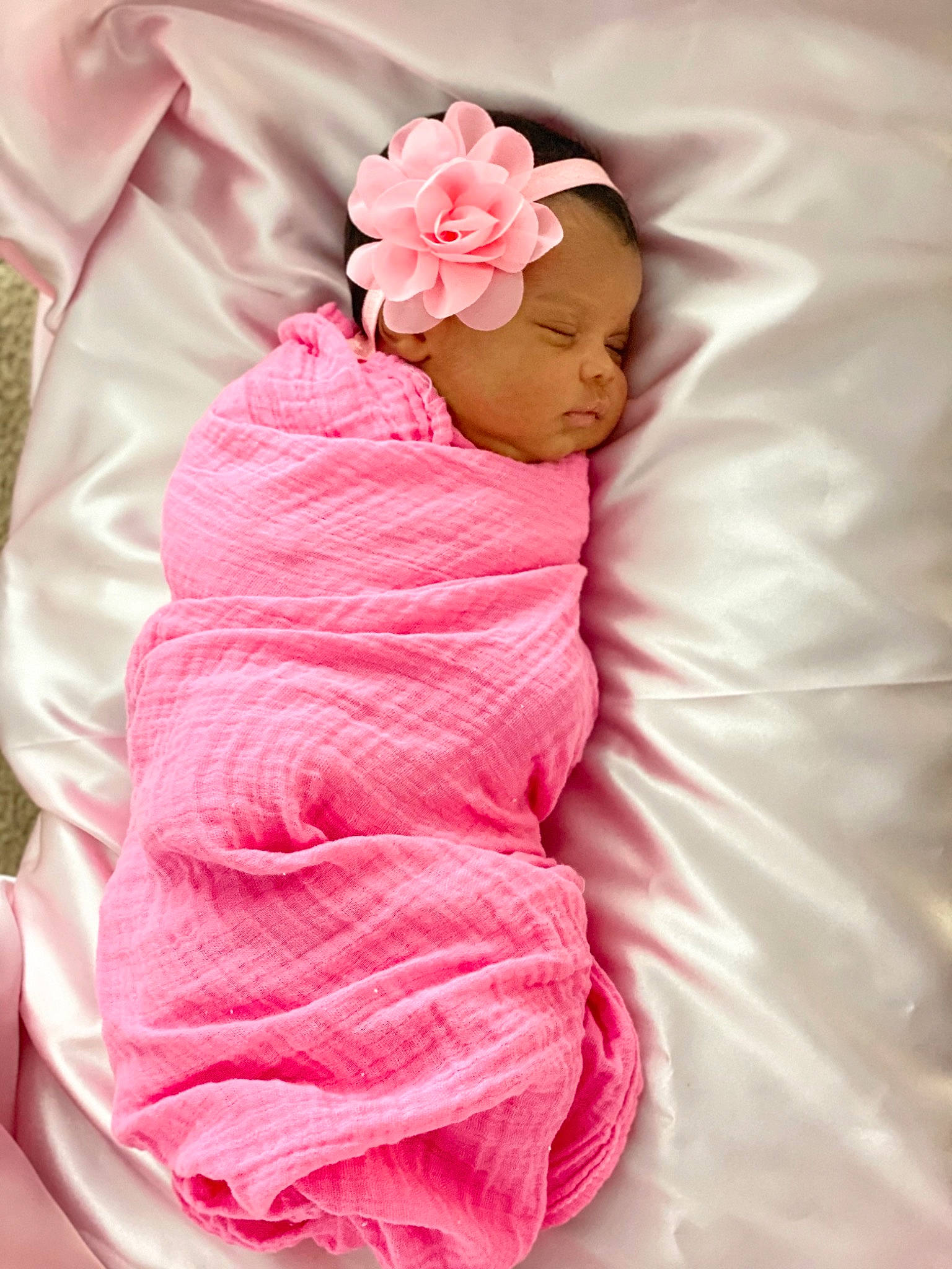 Alaiya is registered to the contest to win money with this photo: arm, baby, baby_products, baby_sleeping, baby_toddler_clothing, bedding, comfort, fashion_accessory, flower, gesture, hand, headwear, linens, lip, magenta, peach, person, petal, pink, sleeve