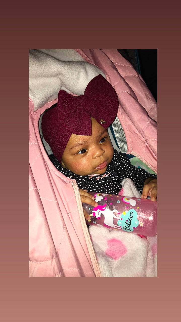 Diamond is registered to the contest to win money with this photo: baby, cheek, child, eye, forehead, headgear, headwear, magenta, person, photography, pink, skin, smile, toddler