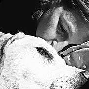 Opium a rejoint le concours — aidez-le/la à gagner de superbes lots ! dog, person, close_up, black_and_white, face, pet, animal, portrait, cozy, blanket, intimate, nose, fur, human, love, affection, sleepy, resting, blurred_background, indoor