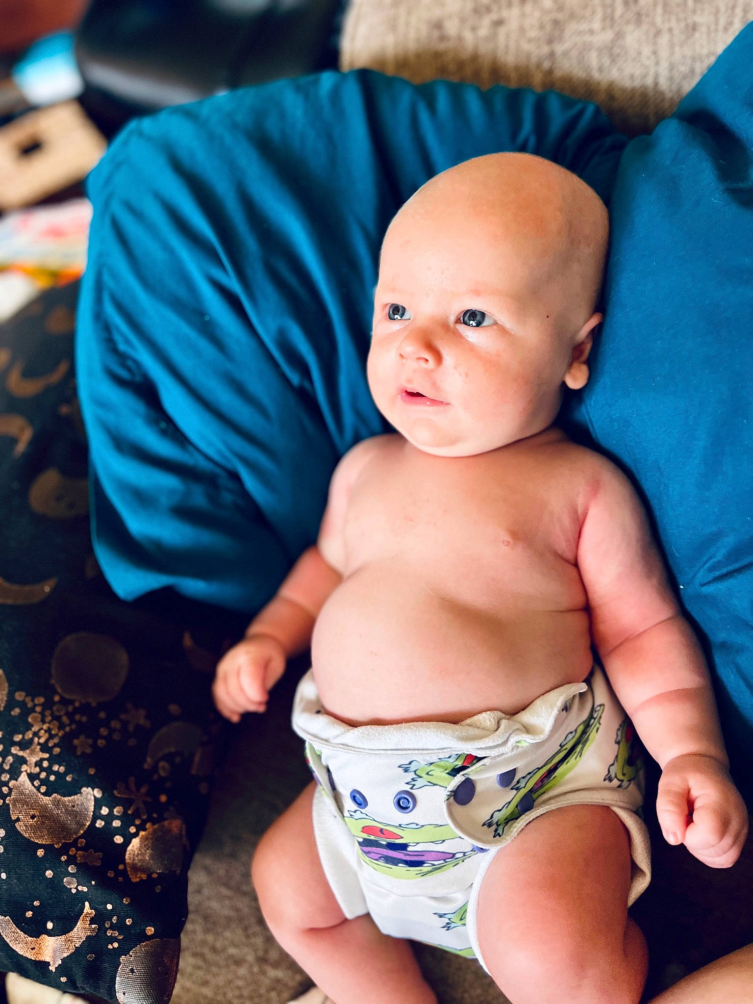 Alevander is registered to the contest to win money with this photo: aqua, azure, baby, baby_toddler_clothing, blue, comfort, eye, happy, head, human_body, leg, mouth, organ, person, photograph, product, skin, stomach, textile, thumb