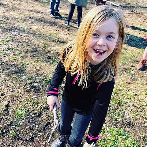 Madeline is registered to the contest to win money with this photo: blond, child, fun, grass, grassland, happy, human_leg, joy, leisure, people_in_nature, person, plant, recreation, shoe, sitting, sleeve, smile, sneakers, soil, sweatpant