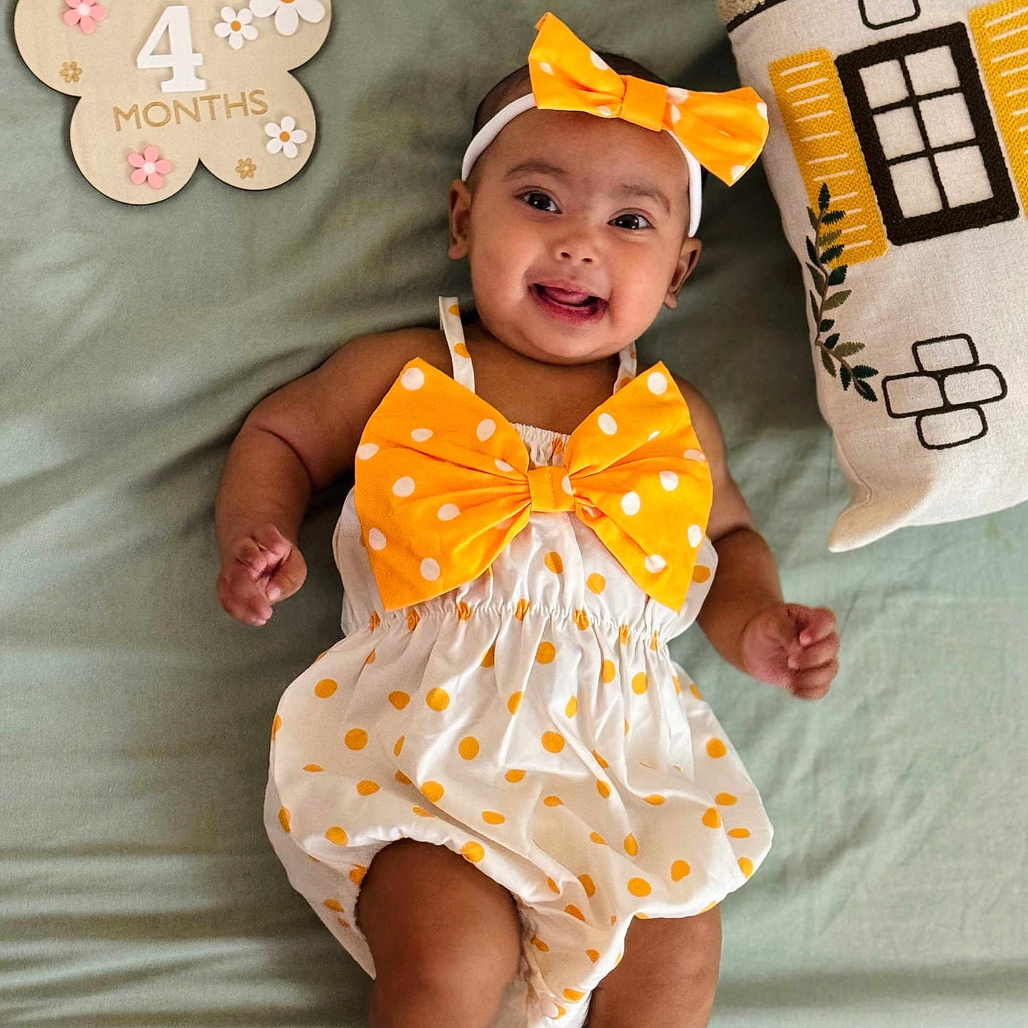 Zaifa is registered to the contest to win money with this photo: baby, blanket, bow, child, cute, decor, dress, flower_sign, foot, hand, happy, headband, indoors, infant, lying_down, months, pillow, polka_dot, skin, smiling