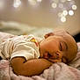 baby, sleeping, blanket, soft, cozy, bokeh, closeup, infant, child, rest, peaceful, cute, warm, comfort, portrait, face, clothing, indoors, relaxation, toddler
