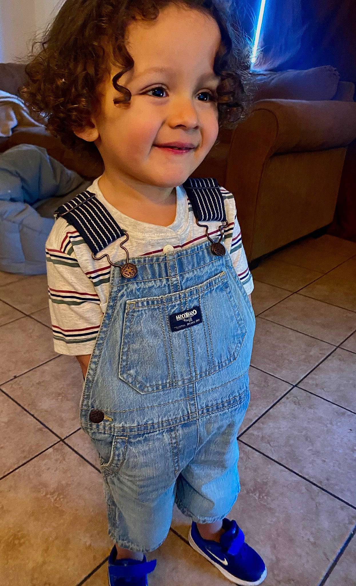 Eden is registered to the contest to win money with this photo: baby_toddler_clothing, blue, cheek, child, chin, electric_blue, eye, face, flooring, hair, happy, head, iris, joy, pattern, person, skin, sleeve, smile, standing