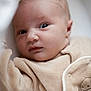 Maë a rejoint le concours — aidez-le/la à gagner de superbes lots ! baby, infant, closeup, face, eyes, skin, newborn, soft, beige, clothing, cute, portrait, expression, child, young, person, indoor, warm, curious, sleepwear