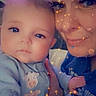 Asher is registered to the contest to win money with this photo: baby, adult, face, sparkle_effect, blue_clothing, closeup, portrait, smile, indoor, cute, child, person, glow, filter, hand, skin, eyelashes, infant, warmth, bonding