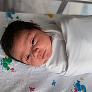 Melany joined the competition — help win amazing prizes! baby, bed, blanket, child, cute, face, hair, head, indoors, infant, newborn, person, portrait, resting, skin, sleeping, soft, swaddled, white, young