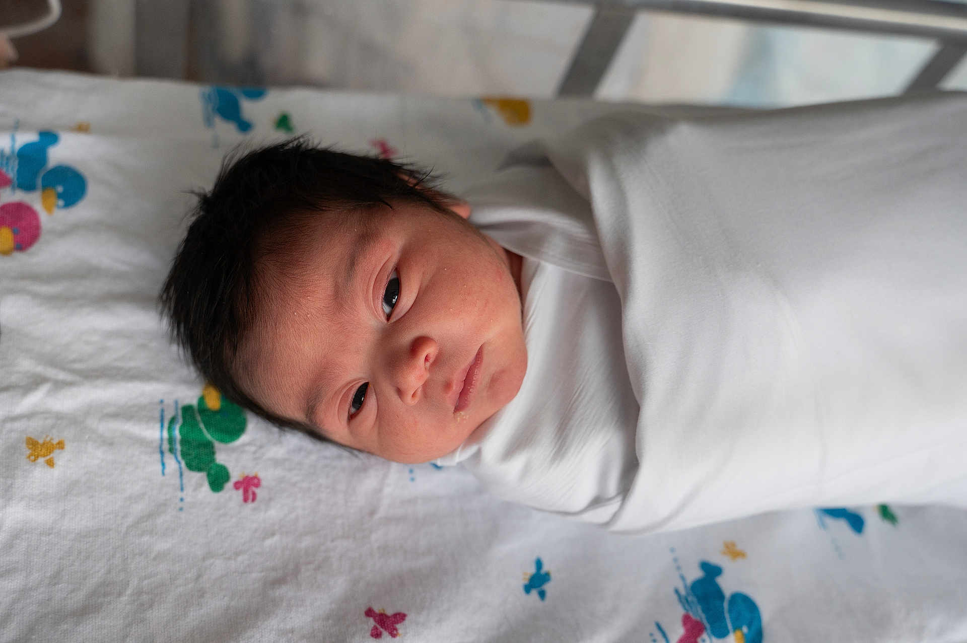 Melany joined the competition — help win amazing prizes! baby, bed, blanket, child, cute, face, hair, head, indoors, infant, newborn, person, portrait, resting, skin, sleeping, soft, swaddled, white, young