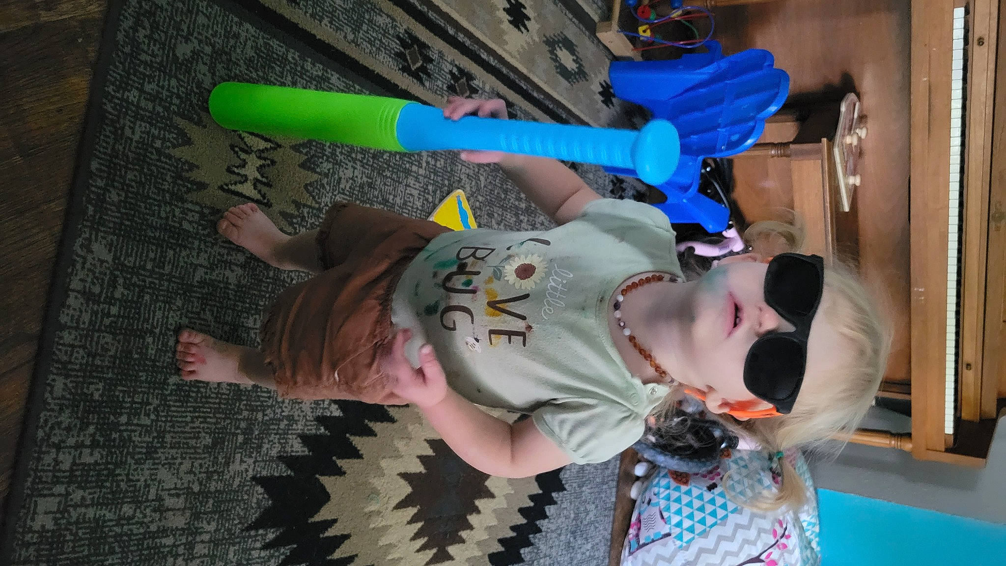 Emberly is registered to the contest to win money with this photo: child, electric_blue, eyewear, fun, happy, leisure, pattern, person, recreation, smile, sunglasses, thigh, toddler, tree, vacation, water