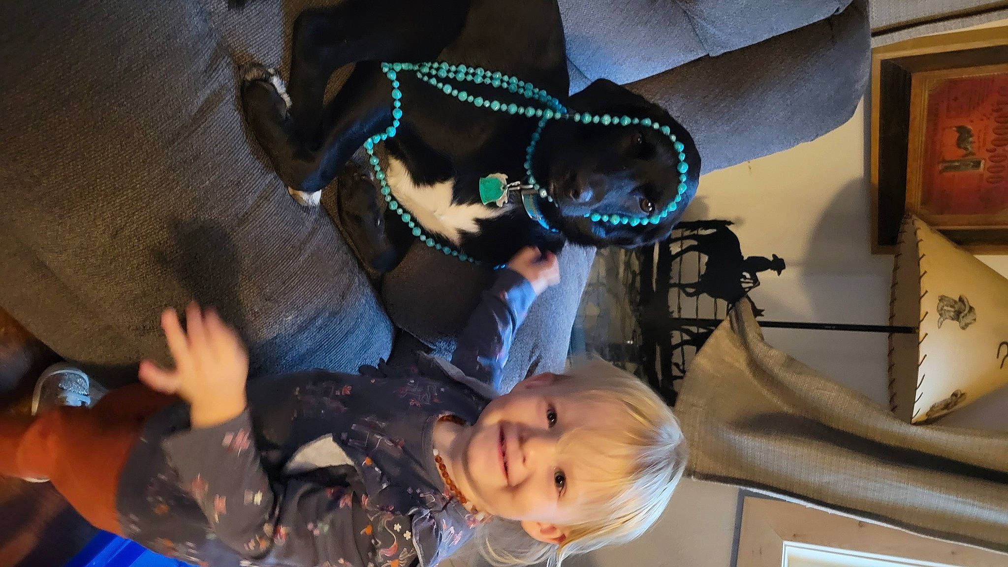 Elowen is registered to the contest to win money with this photo: baby, child, event, eyewear, fashion_accessory, fun, goggles, happy, hat, jewellery, joy, leisure, necklace, person, personal_protective_equipment, picture_frame, smile, suit, sunglasses, toddler