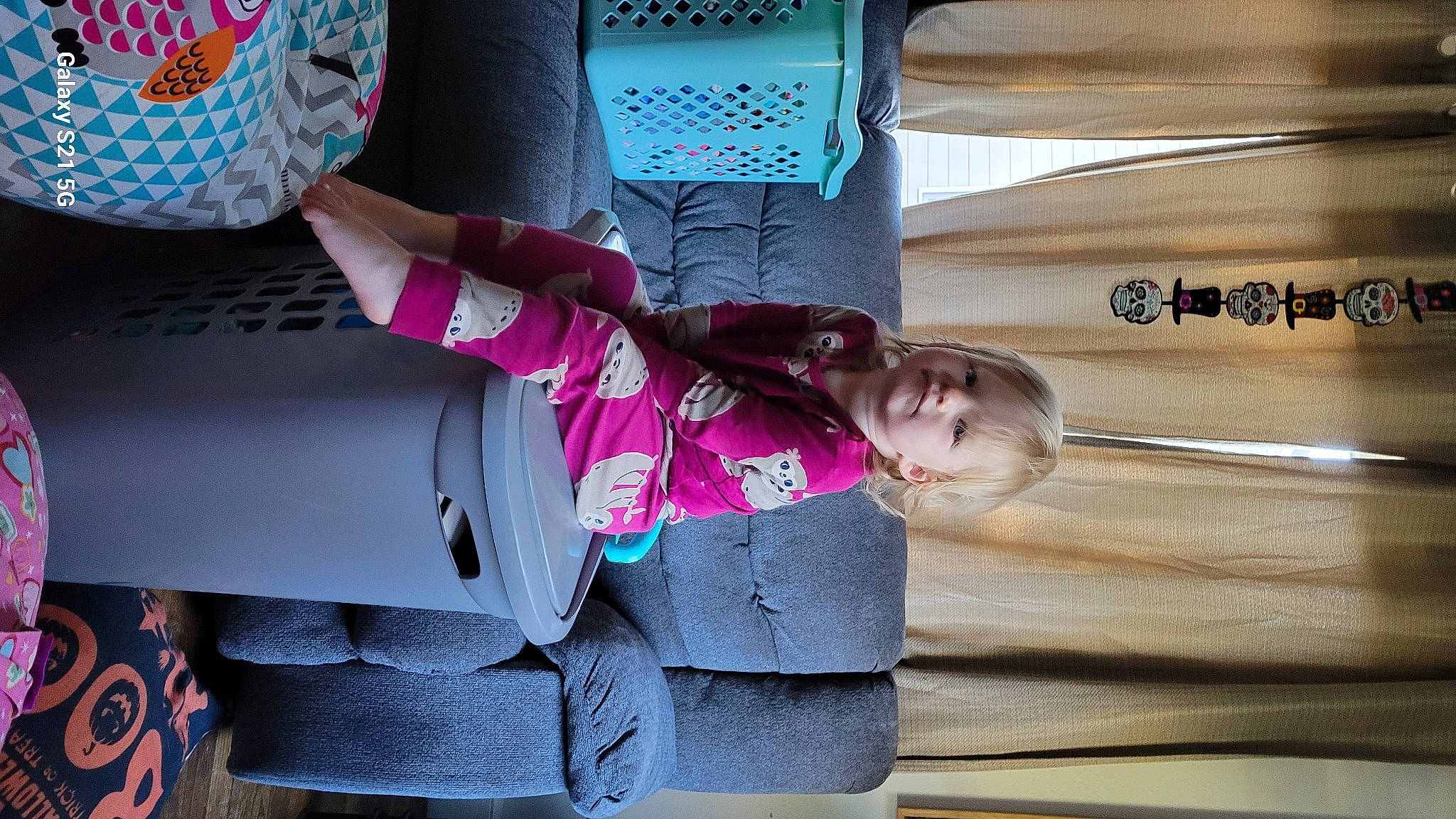 Elowen is registered to the contest to win money with this photo: baby, baby_products, baby_toddler_clothing, child, comfort, fun, leisure, magenta, pattern, person, pink, room, sitting, sleeve, suit, textile, toddler, tree