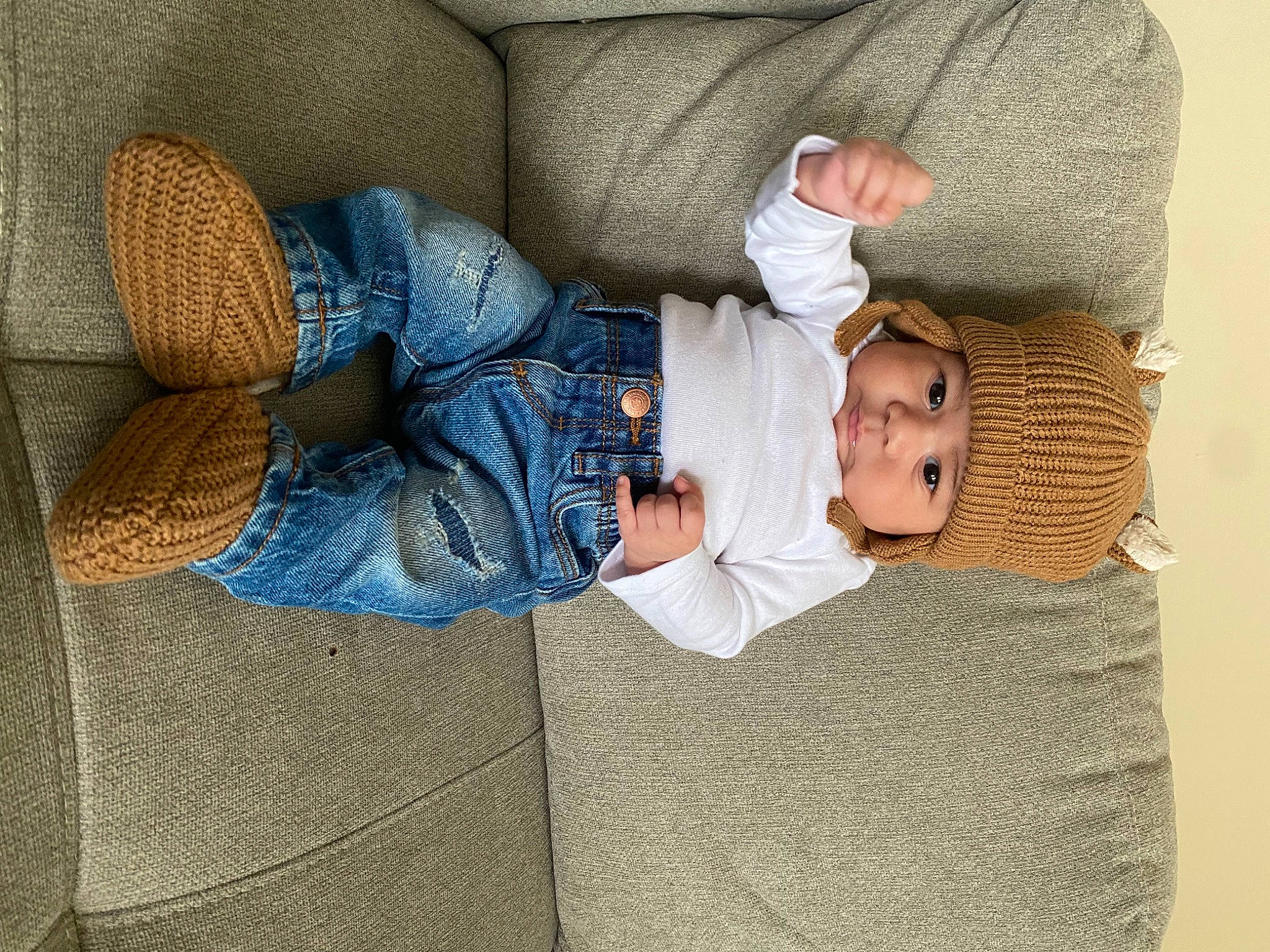 Nico joined the competition — help win amazing prizes! baby, baby_products, baby_toddler_clothing, child, comfort, denim, flooring, hand, headwear, human_body, human_leg, lap, leg, linens, nap, pattern, person, room, sitting, sock