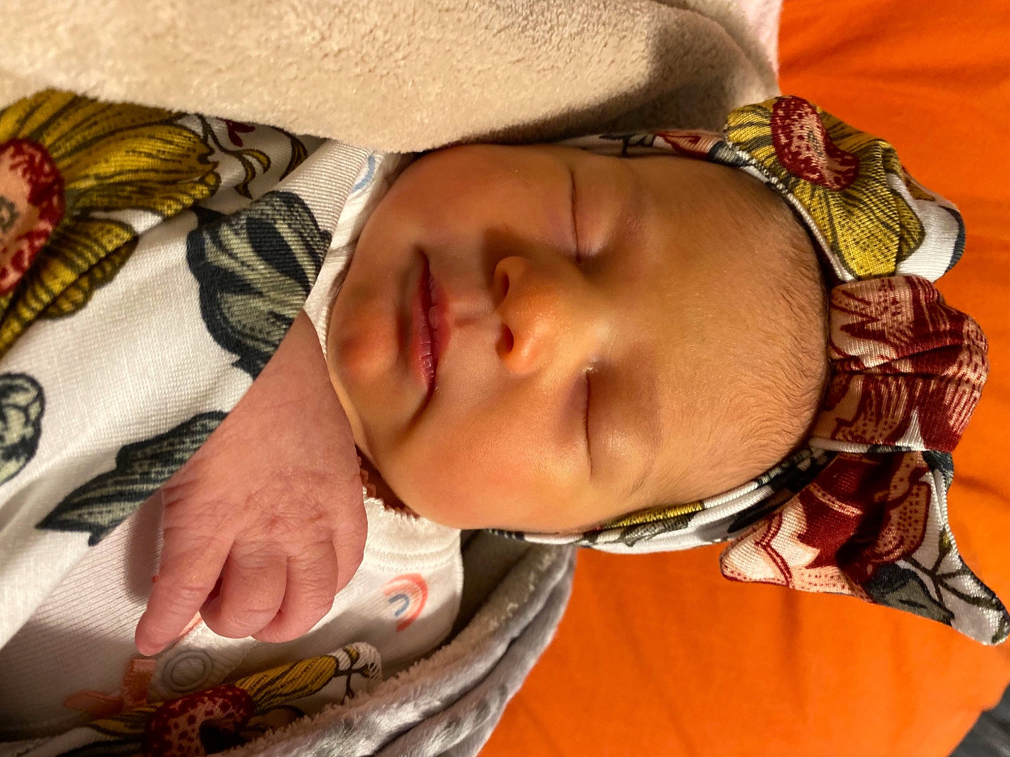 Addison is registered to the contest to win money with this photo: arm, baby, cheek, chest, child, comfort, eye, eyelash, finger, head, headgear, human_body, mouth, neck, nose, organ, person, skin, textile, toddler