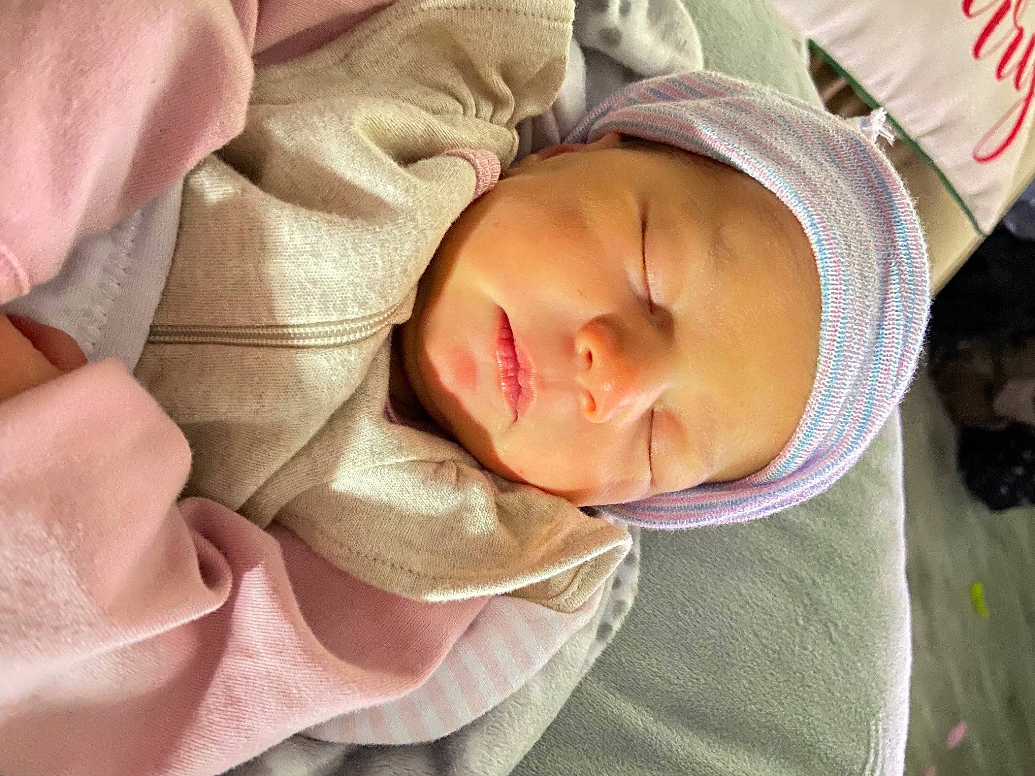 Addison is registered to the contest to win money with this photo: baby, baby_products, baby_sleeping, baby_toddler_clothing, bedtime, cheek, child, close_up, comfort, grass, headwear, linens, lip, nap, nose, person, portrait_photography, skin, sleep, sleeve