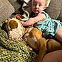 Mary is registered to the contest to win money with this photo: baby, dog, sleeping, couch, blanket, infant, pet, cozy, indoor, child, resting, comfort, animal, clothing, furniture, relaxation, face, skin, hand, cute