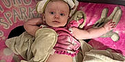 Mary joined the competition — help win amazing prizes! baby, diaper, blanket, pink, towel, cloth, infant, child, cute, laying, face, expression, soft, cozy, indoors, person, young, skin, headwear, comfort