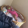 Kya joined the competition — help win amazing prizes! baby, infant, sleeping, pacifier, pink_onesie, wicker_basket, blanket, toy, indoor, cozy, child, resting, cute, furniture, bedroom, soft_lighting, peaceful, person, toddler, relaxing