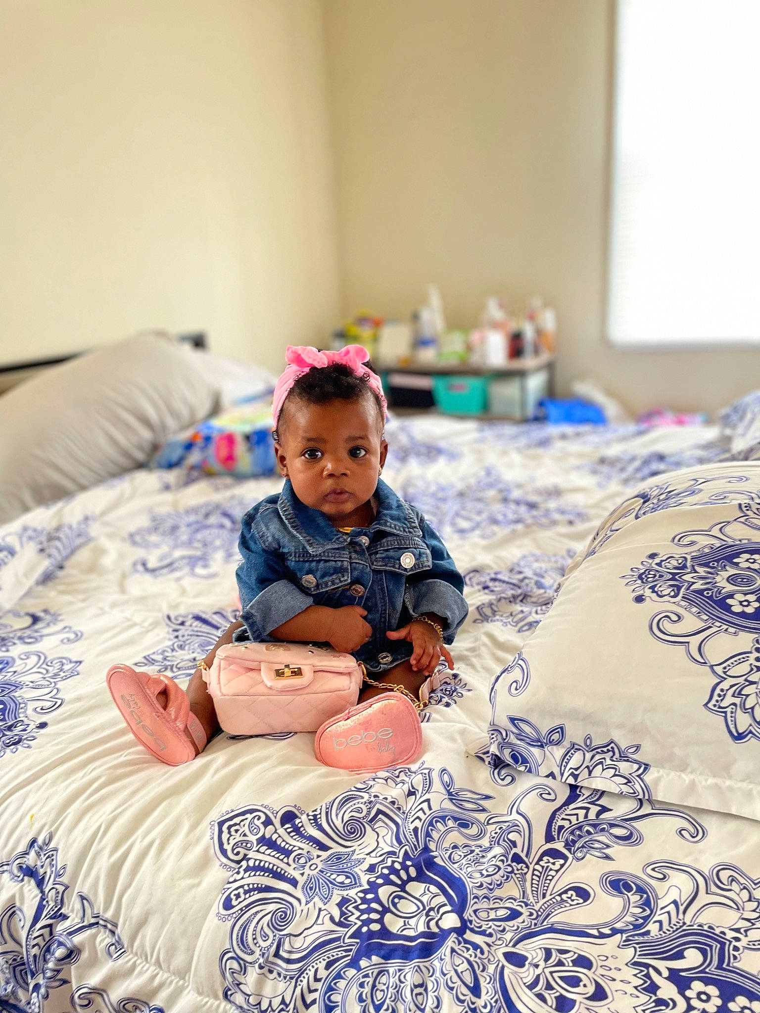 Sincere is registered to the contest to win money with this photo: azure, baby, baby_toddler_clothing, bed_sheet, bedding, comfort, dress, event, flooring, happy, leisure, linens, pattern, person, purple, room, sitting, sleeve, t_shirt, textile