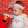 Blakely is registered to the contest to win money with this photo: accessories, applique, architecture, baby, bodypart, bonnet, brick, building, cap, clothing, costume, couch, cream, dessert, doll, dress, elf, face, finger, food