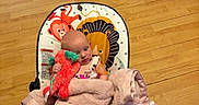 Azriella joined the competition — help win amazing prizes! baby, blanket, stuffed_toy, baby_seat, floor, wooden_floor, indoor, child, infant, toy, animal_print, pink, red, person, comfort, home, cute, relaxing, soft, bundle