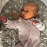 Azriella joined the competition — help win amazing prizes! baby, bedtime, child, cozy, cute, fabric, indoors, infant, lying_down, mesh_canopy, newborn, onesie, pacifier, pink_clothing, portrait, quilt, sleeping_bag, small_hands, soft_lighting, star_pattern