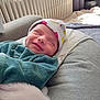 Léna a rejoint le concours — aidez-le/la à gagner de superbes lots ! baby, blanket, child, clothing, comfort, cozy, cushion, face, hat, indoor, light, newborn, peaceful, portrait, radiator, resting, sleeping, smiling, soft, warm