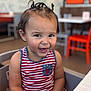 Zareya joined the competition — help win amazing prizes! toddler, child, smiling, happy, striped_dress, pigtails, high_chair, indoor, restaurant, table, chair, person, cute, portrait, casual, seated, hair, face, baby, fun