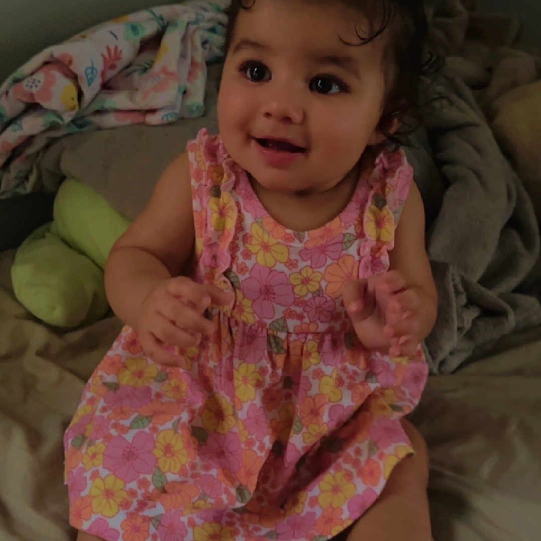 Kaylanii joined the competition — help win amazing prizes! baby, barefoot, bed, bodypart, clothing, couch, cushion, dress, face, finger, furniture, hand, happy, head, homedecor, person, photography, portrait, sitting, smile