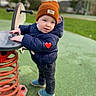 Vladimir a rejoint le concours — aidez-le/la à gagner de superbes lots ! beanie, blue_jacket, casual_shoes, child, curious, cute, daylight, greenery, orange_hat, outdoor, park, person, play, playground, spring_rocker, toddler, toy, warm_clothing, winter_clothes, young_child