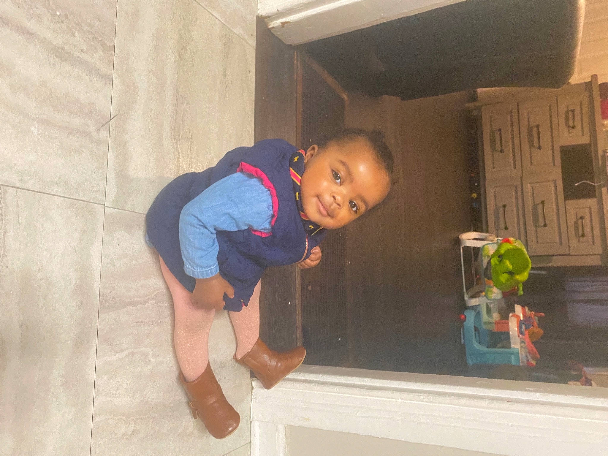 Madia is registered to the contest to win money with this photo: baby, baby_toddler_clothing, child, electric_blue, flooring, fun, happy, hat, joy, knee, leisure, person, play, room, shorts, sitting, sleeve, smile, t_shirt, toddler