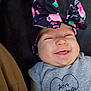 Jayca is registered to the contest to win money with this photo: baby, smile, tongue, headband, bow, floral, clothing, infant, cute, happy, portrait, person, child, apparel, fabric, closeup, face, cheerful, sitting, indoor