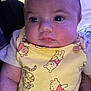 Azaiah is registered to the contest to win money with this photo: baby, infant, face, close_up, child, yellow_clothing, winnie_the_pooh, cartoon_print, cute, chubby_cheeks, short_hair, indoor, person, portrait, young_child, soft_lighting, button, toddler, expression, curious