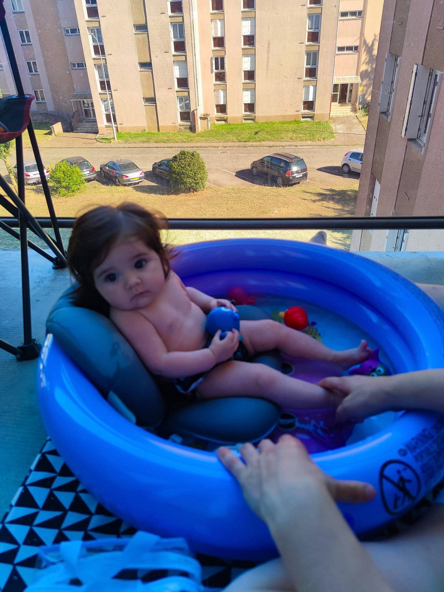 Elena participe au concours pour gagner de l'argent avec cette photo : azure, blue, building, comfort, electric_blue, fun, human_body, inflatable, lap, leisure, outdoor_furniture, outdoor_recreation, person, plant, recreation, swimming_pool, thigh, toddler, tripod, water