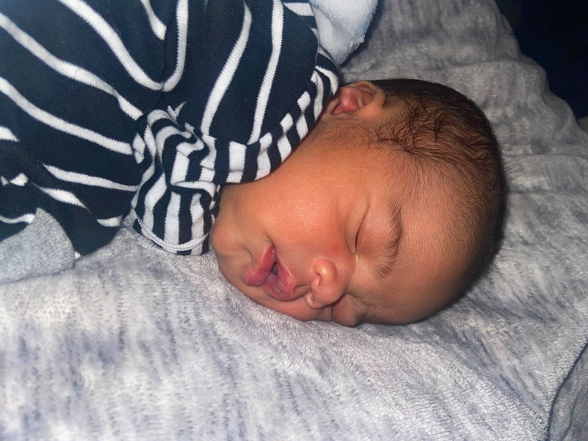 Kadyn is registered to the contest to win money with this photo: baby, baby_sleeping, baby_toddler_clothing, bedding, bedtime, child, comfort, grey, linens, nap, nose, pattern, person, portrait_photography, room, skin, sleep, sleeve, textile, toddler