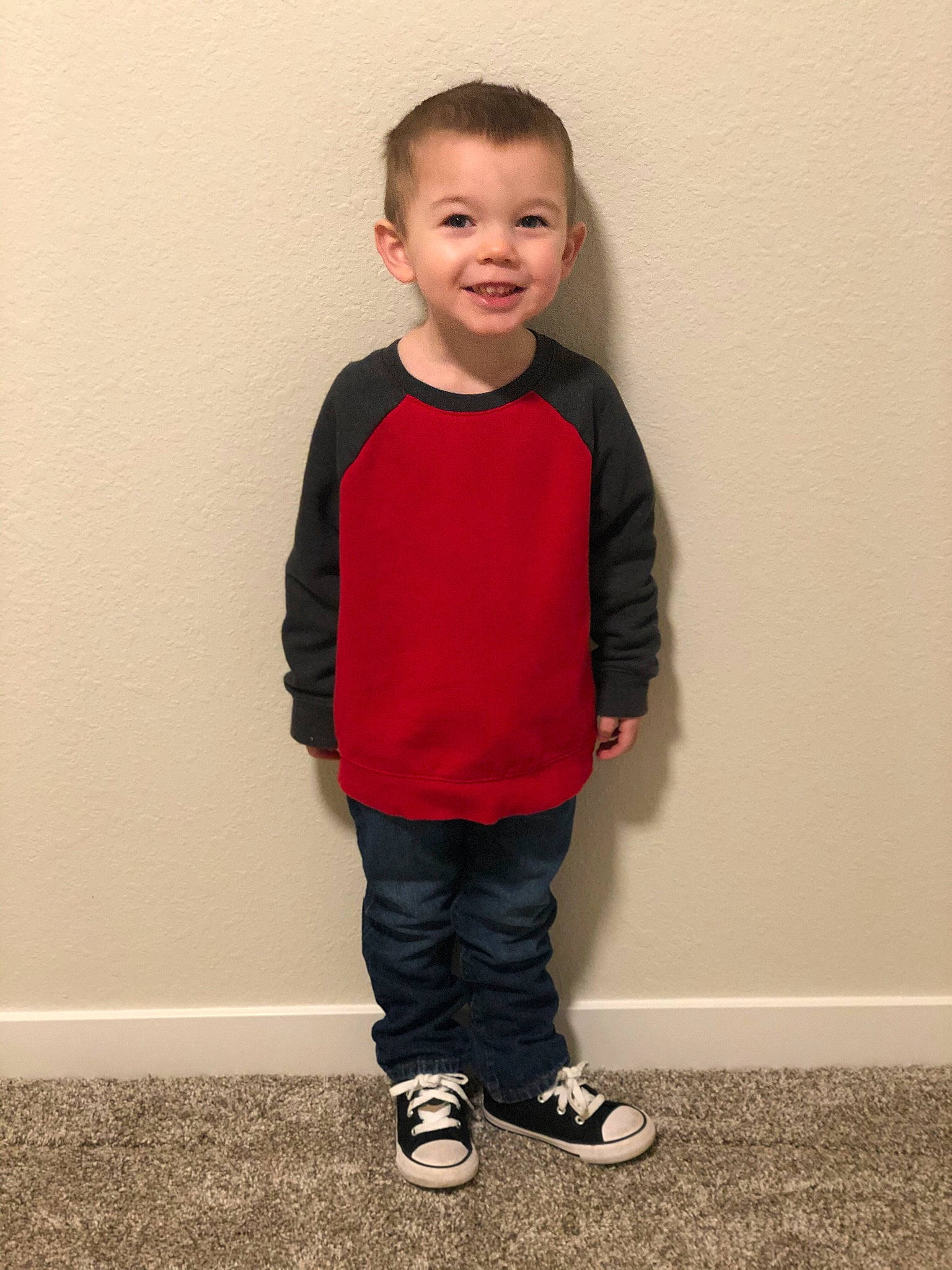 Griffin is registered to the contest to win money with this photo: baby_toddler_clothing, cheek, denim, face, flash_photography, flooring, footwear, happy, head, human_body, jeans, joy, knee, leg, pattern, person, shoe, shoulder, sleeve, smile