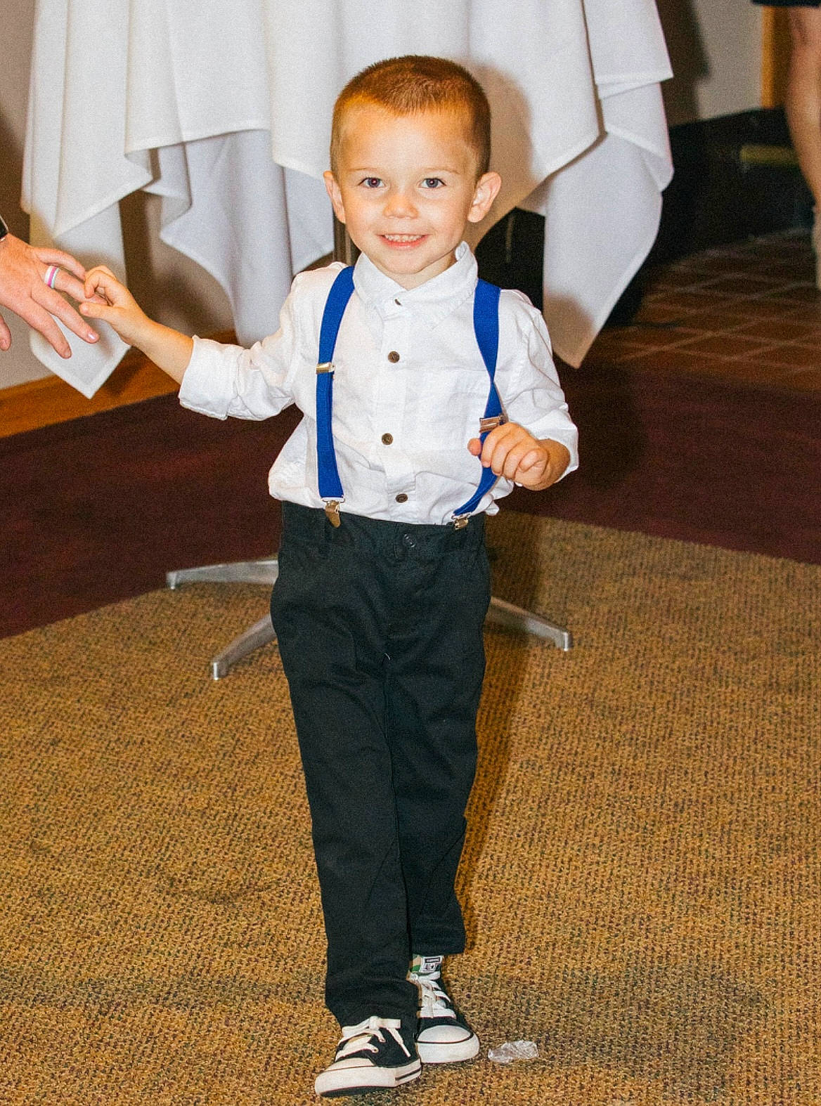Griffin is registered to the contest to win money with this photo: blazer, carpet, child, dress_shirt, electric_blue, event, flooring, formal_wear, fun, gesture, happy, joy, person, shoe, sleeve, smile, suit, tie, toddler, tuxedo