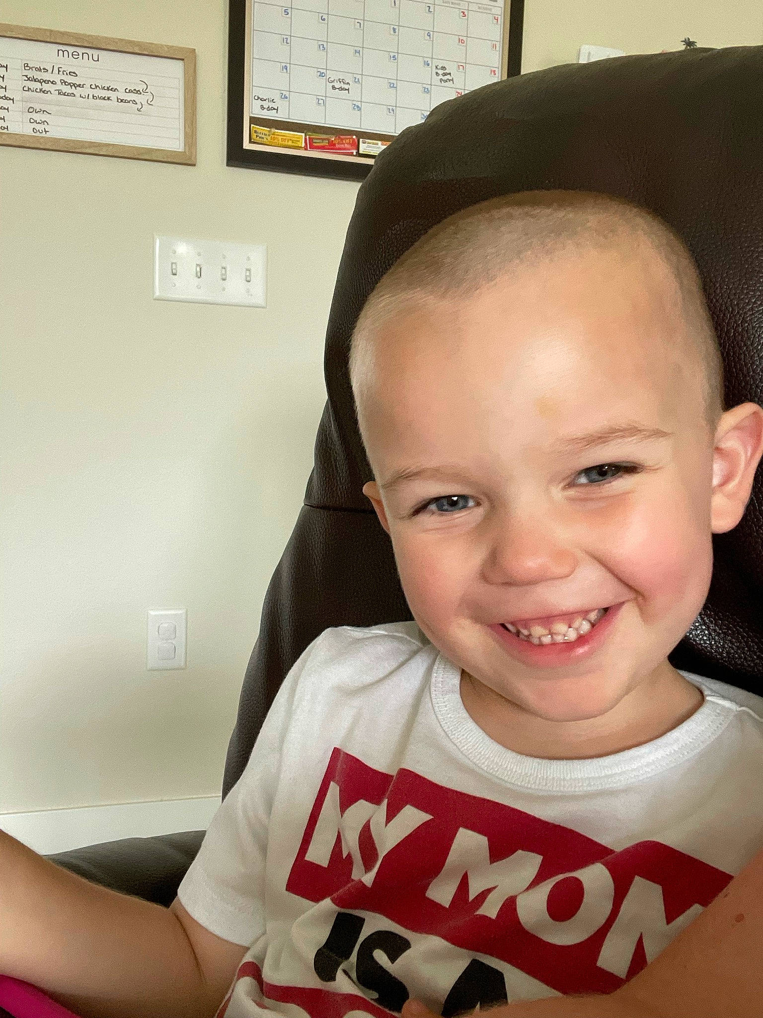 Griffin is registered to the contest to win money with this photo: cheek, cool, ear, eyebrow, eyelash, finger, forehead, gesture, hairstyle, happy, jaw, joy, lip, mouth, neck, nose, person, picture_frame, skin, sleeve