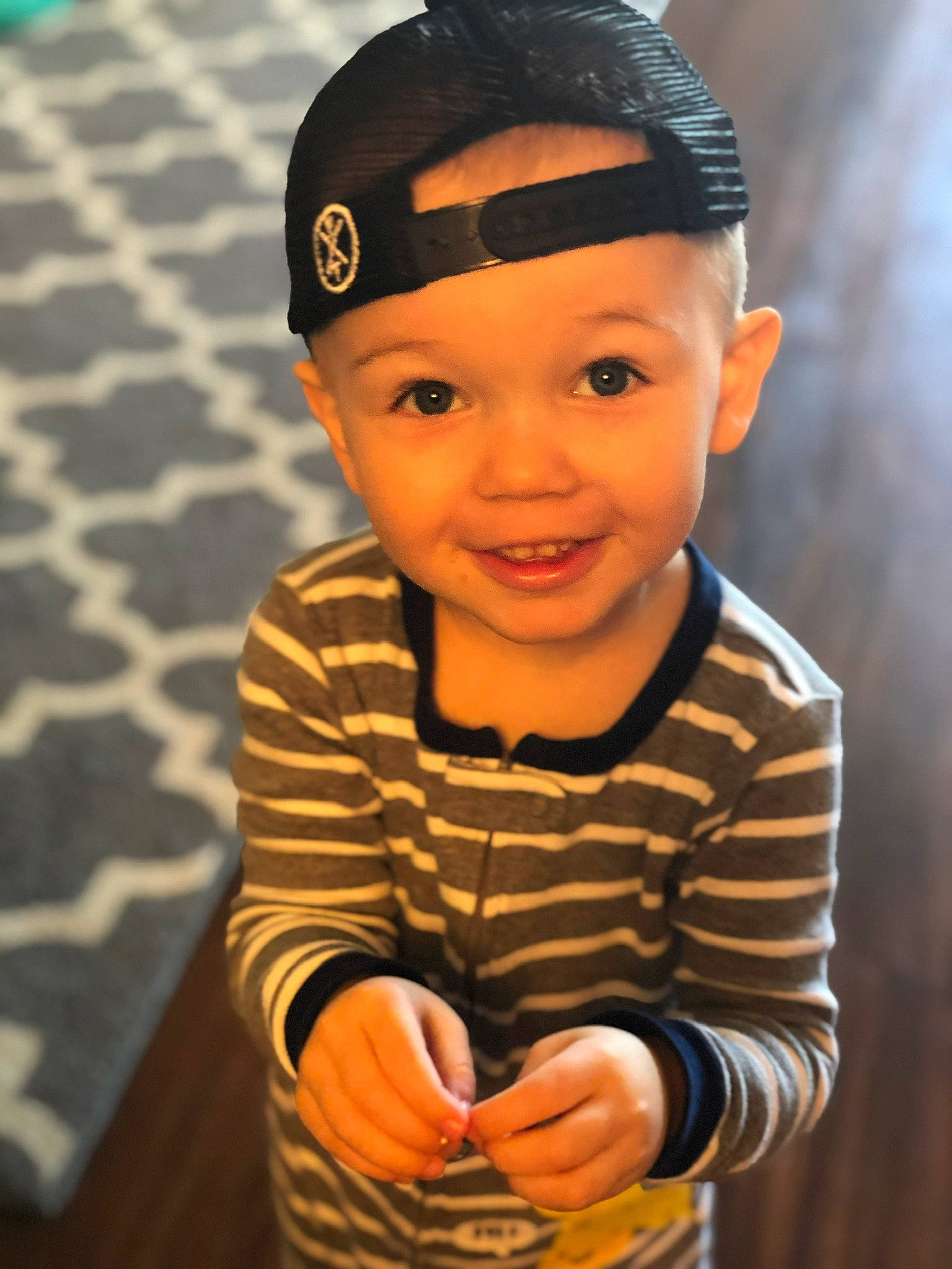 Griffin is registered to the contest to win money with this photo: baby, baby_toddler_clothing, cap, cheek, child, electric_blue, eyewear, face, fashion_accessory, flash_photography, fun, happy, headwear, joy, laugh, person, personal_protective_equipment, portrait_photography, sitting, sleeve