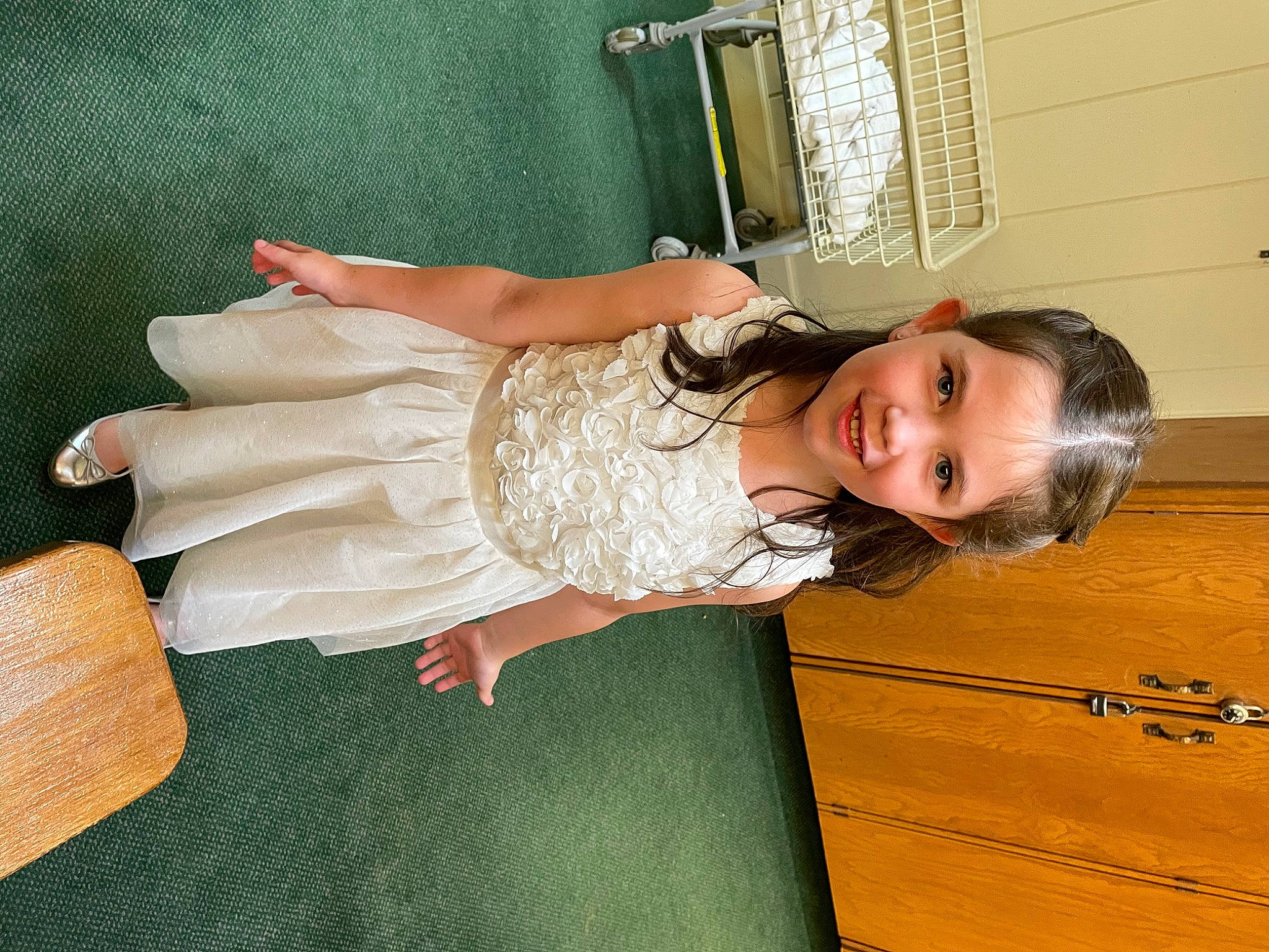 Charlie is registered to the contest to win money with this photo: baby_toddler_clothing, child, comfort, day_dress, dress, facial_expression, flooring, hair, hand, happy, hardwood, human_leg, joy, knee, person, room, skin, smile, thigh, toddler