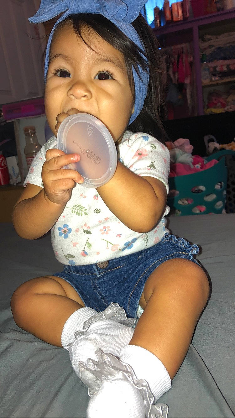 Violetta is registered to the contest to win money with this photo: baby, baby_bottle, baby_toddler_clothing, cheek, child, drinking, drinkware, fun, human_leg, joint, knee, mouth, nail, neck, nose, person, plastic_bottle, skin, thigh, thumb