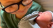 Chase joined the competition — help win amazing prizes! baby, blanket, bonding, cap, child, clothing, cozy, cute, face, family, glasses, holding, indoor, love, newborn, person, portrait, sleeping, smile, toddler