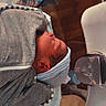 Kamari is registered to the contest to win money with this photo: newborn, baby, hospital, bassinet, blanket, hat, sleeping, infant, cozy, wrapped, child, person, bed, medical, resting, cute, small, soft, indoor, healthcare