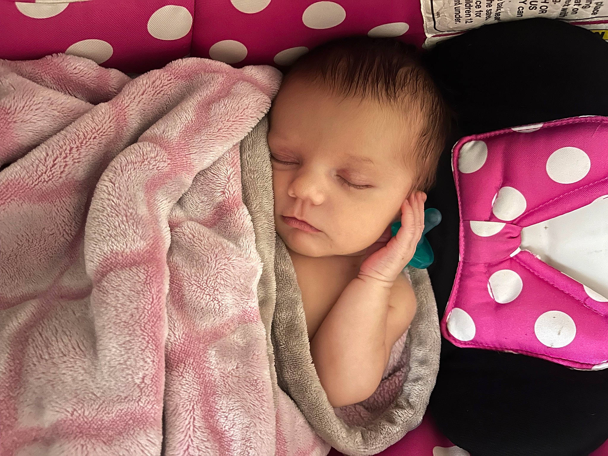 Julie is registered to the contest to win money with this photo: baby, baby_products, baby_sleeping, baby_toddler_clothing, cheek, child, comfort, eyelash, finger, happy, linens, magenta, pattern, person, pink, play, sitting, skin, sleeve, textile