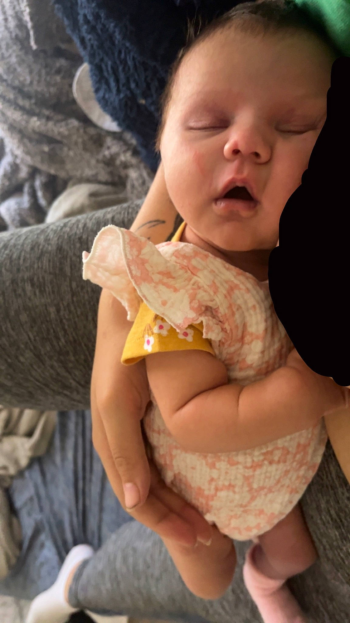 Julie is registered to the contest to win money with this photo: abdomen, arm, baby, baby_toddler_clothing, child, comfort, dress, elbow, eye, finger, happy, joint, nail, pattern, person, reptile, scaled_reptile, serpent, sitting, skin