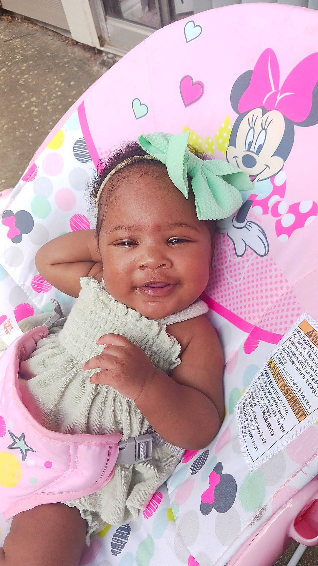 Danielle is registered to the contest to win money with this photo: baby, baby_products, baby_toddler_clothing, cap, cheek, child, eyelash, fashion_accessory, fun, happy, linens, lip, magenta, pattern, person, pink, skin, sleeve, smile, textile
