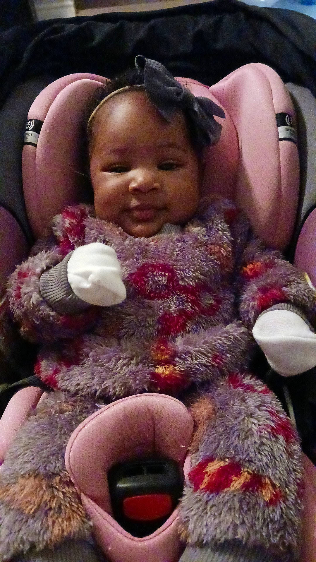 Danielle is registered to the contest to win money with this photo: baby_toddler_clothing, child, comfort, finger, fun, happy, headgear, lap, magenta, mammal, person, pink, purple, skin, smile, stuffed_toy, teddy_bear, textile, toddler, toy